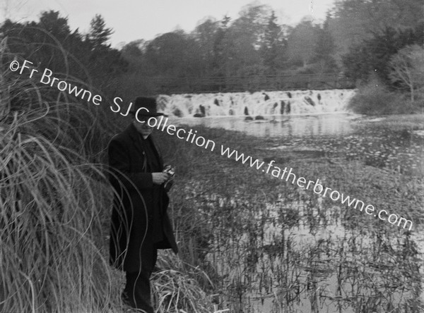 RIVER LIFFEY IN SPATE NEAR CELBRIDGE WITH MAN